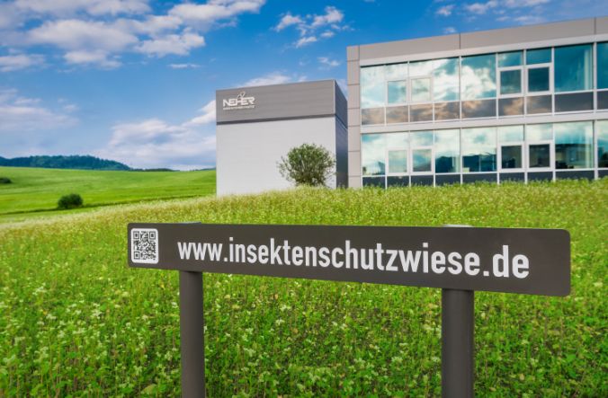 Neher insect protection meadow with Neher company building in the background